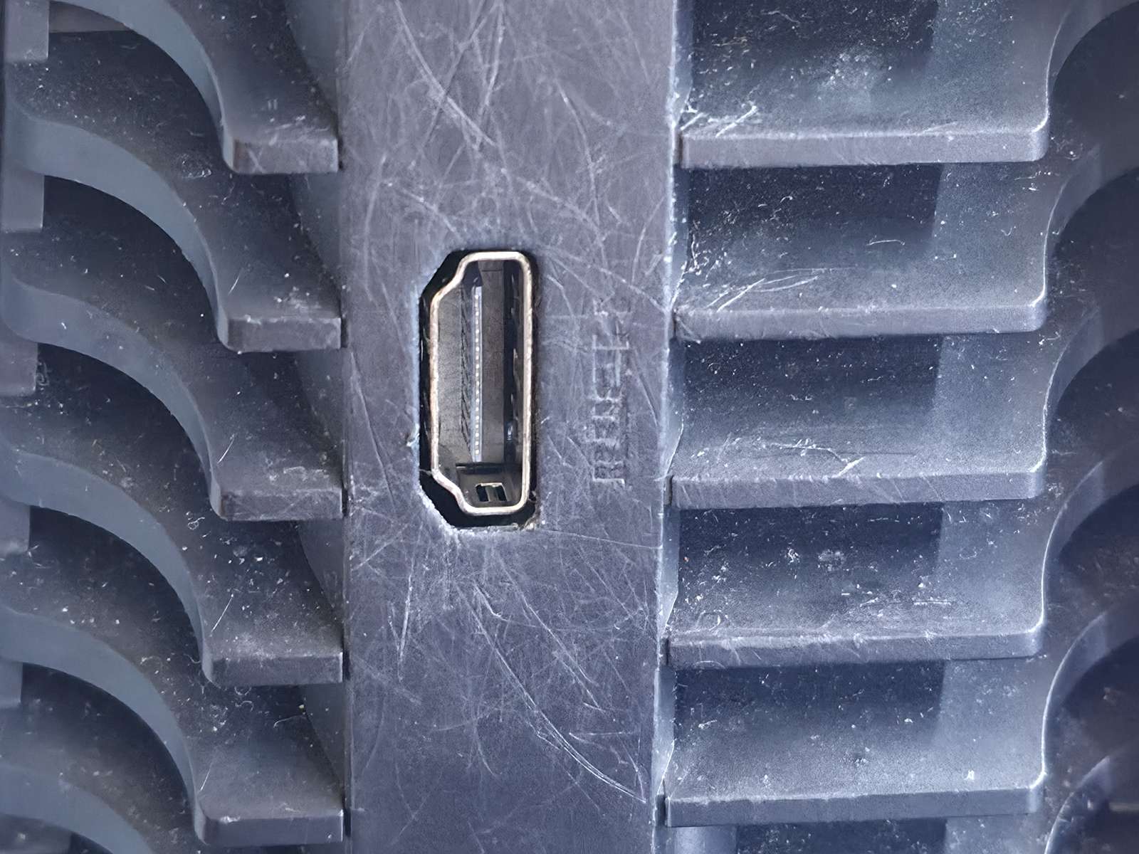 PS5 rear panel with a damaged HDMI port before repair at Circuit Savages Palmdale