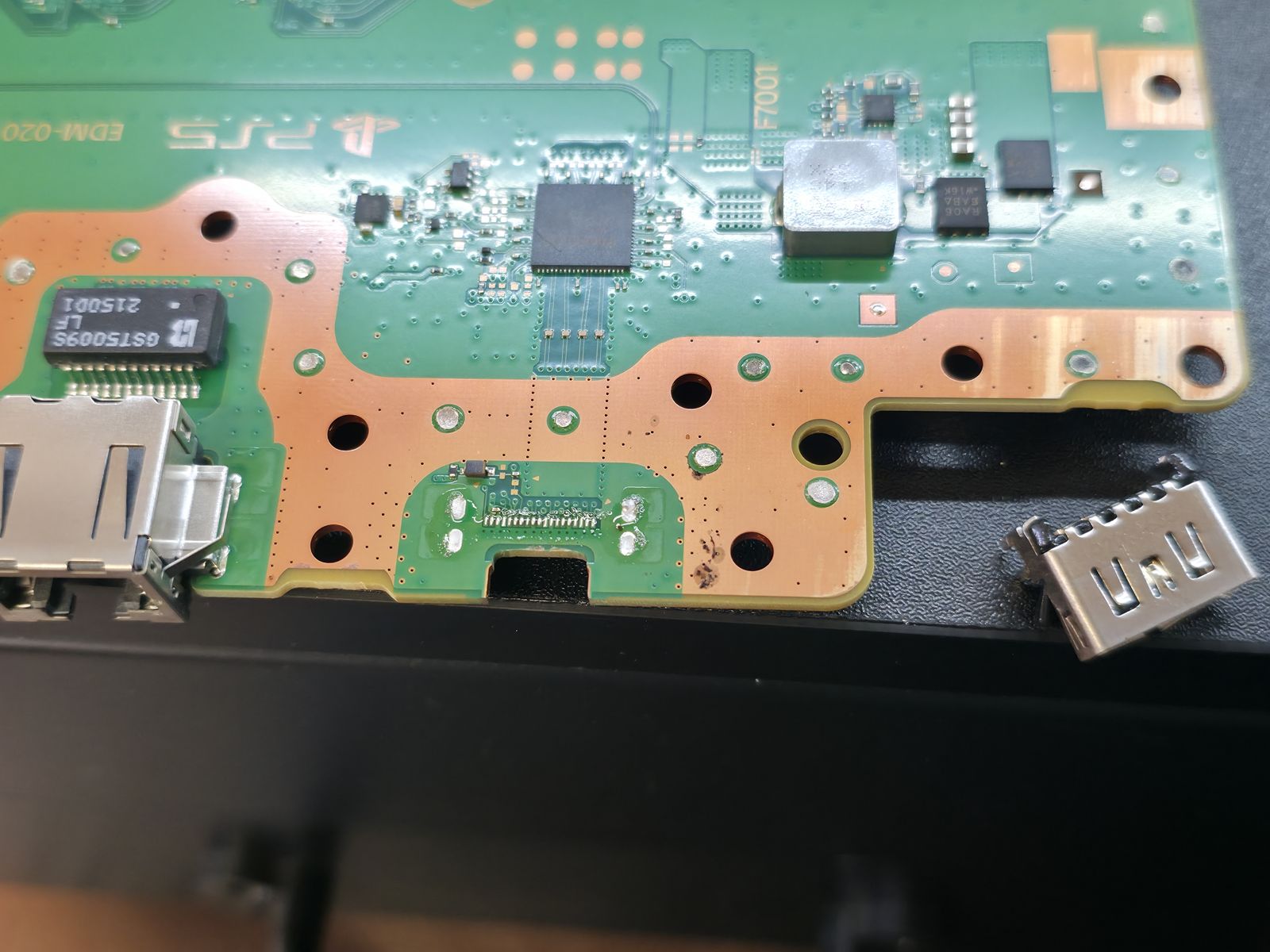 PS5 motherboard with HDMI pads cleaned and ready for a new port